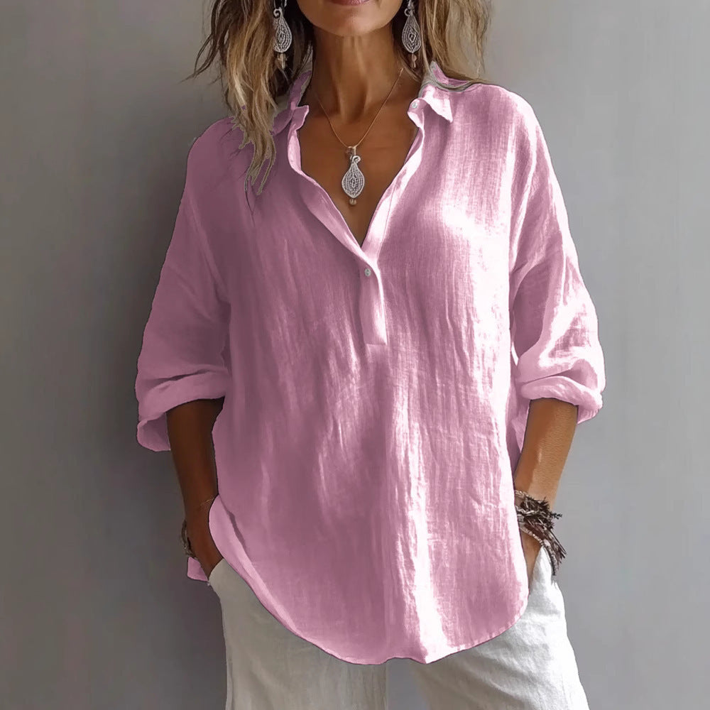 Woman wearing a stylish pink long-sleeved lapel pullover shirt, featuring a relaxed fit and rolled sleeves.