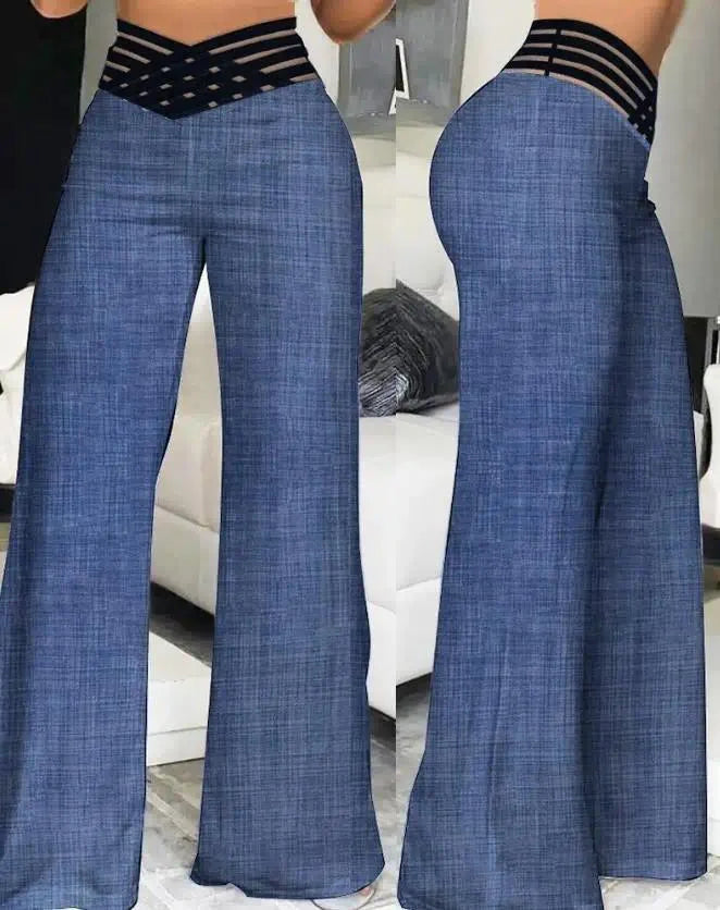 Blue wide-leg jeans worn by a person in a room with a white couch.