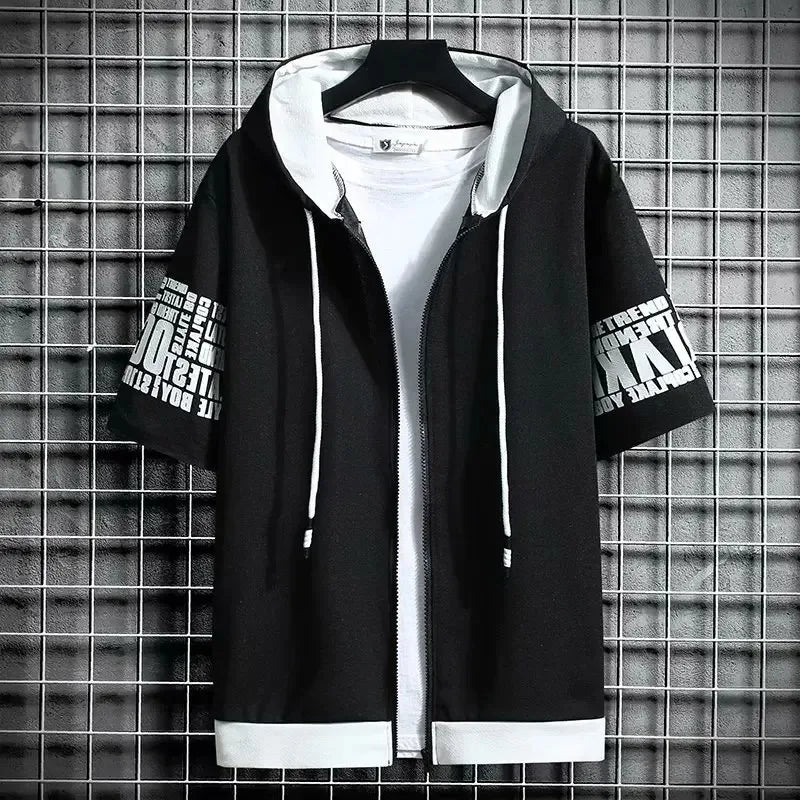 Black hoodie with white text on sleeves against a grid-patterned wall