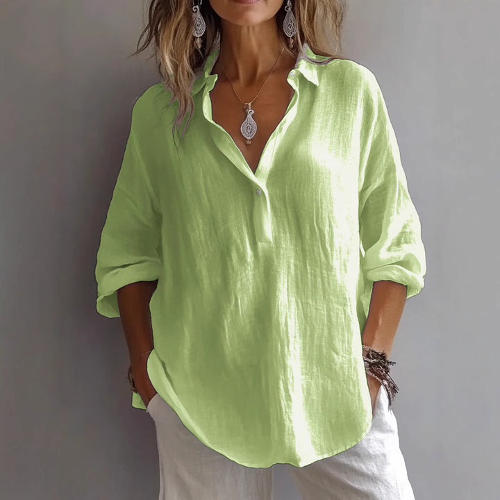Women's loose-fitting pullover shirt in vibrant lime green, featuring a lapel collar and 3/4 sleeves.
